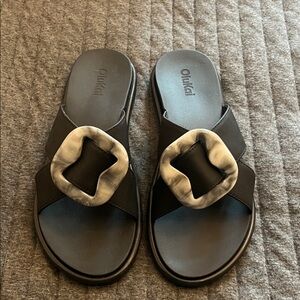 OluKai Black and White Sandals